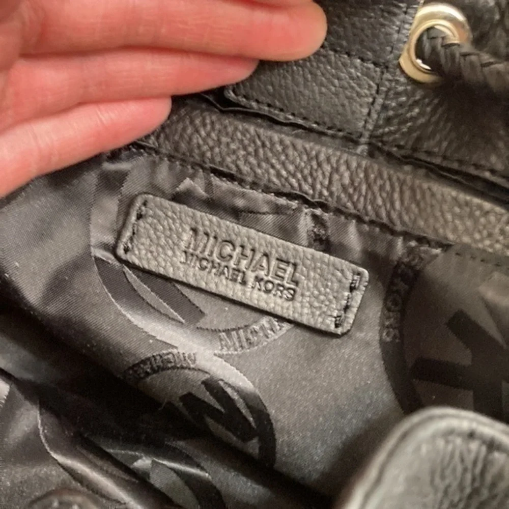 Michael kors mini black leather drawstring bag